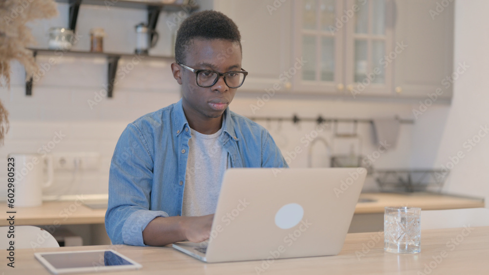 Young African Man Working on Laptop Young African Man Working on Laptop
