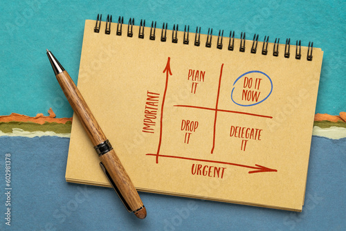 urgent versus important - Eisenhower matrix, sketch in a notebook, productivity and  task management concept