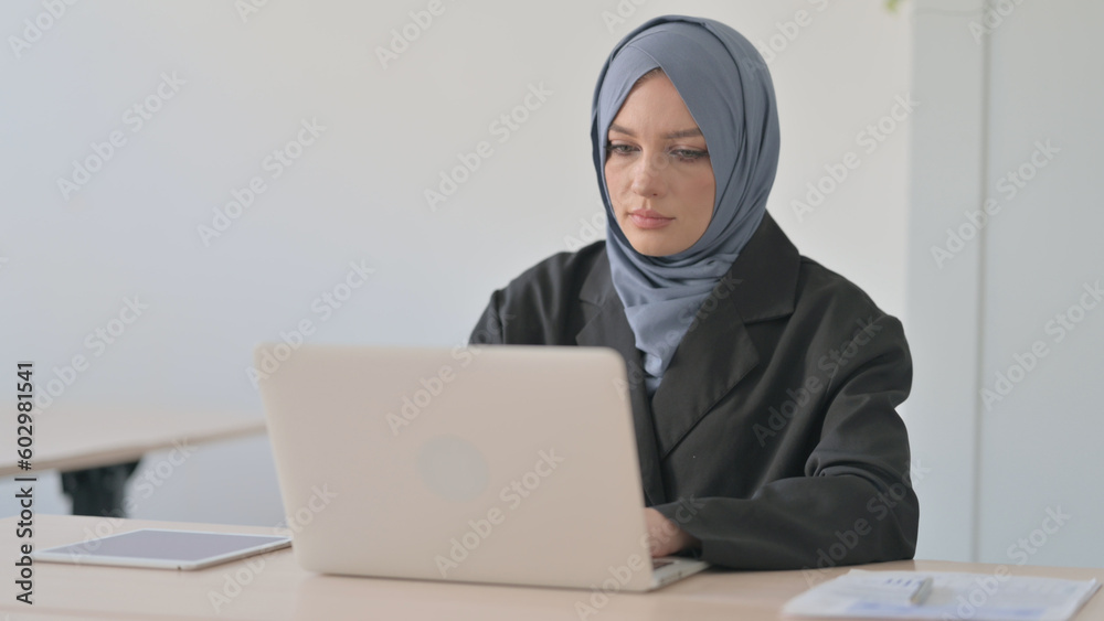 Busy Arab Businesswoman Working on Laptop