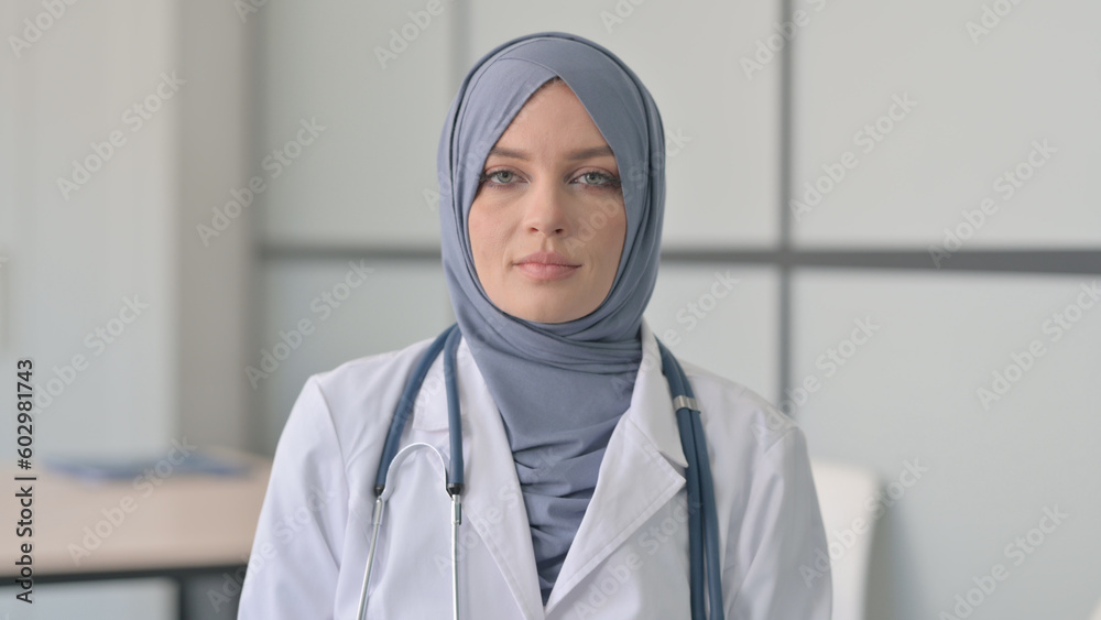 Portrait of Serious Muslim Female Doctor in Clinic Portrait of Serious Muslim Female Doctor in Clinic