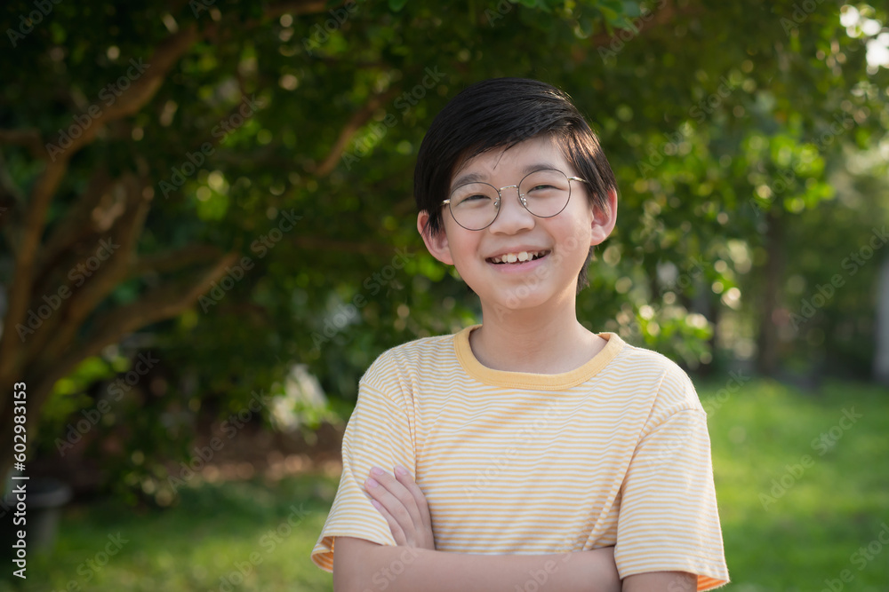 Portrait of asian child wearing glasses smiling with nature background Portrait of asian child wearing glasses smiling with nature background