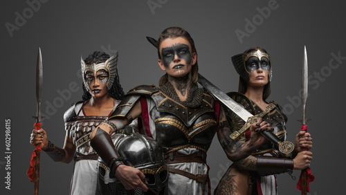 Studio shot of ancient female warriors armed with cold steel posing together.