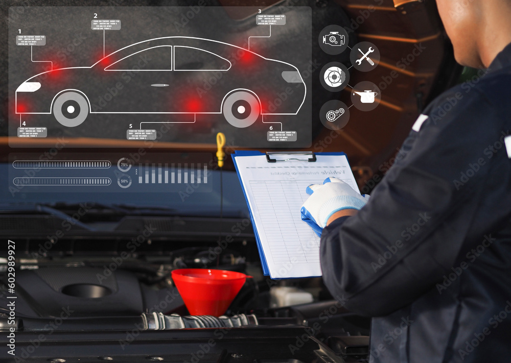 auto mechanic checking car engine with check writing to clipboard checklist for car repair repair and maintenance. Modern car diagnostic program on screen. Car service concept. auto mechanic checking car engine with check writing to clipboard checklist for car repair repair and maintenance. Modern car diagnostic program on screen. Car service concept.