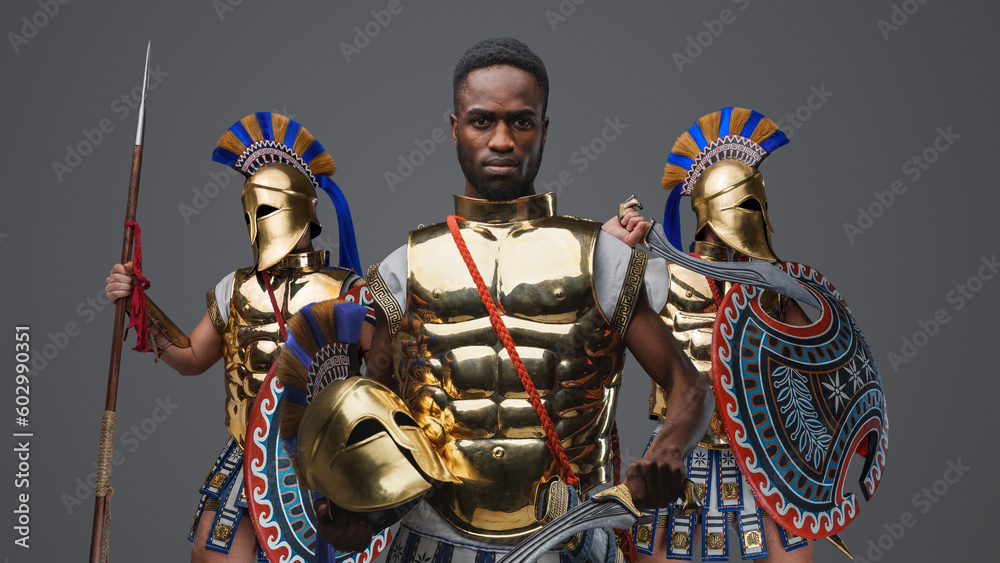 Studio shot of multiethnic group of three soldiers from ancient greece.