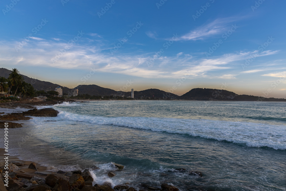 Patong Beach Phuket Thailand nice white sandy beach clear blue and turquoise waters and lovely blue skies with Palms tree sunset sunrise