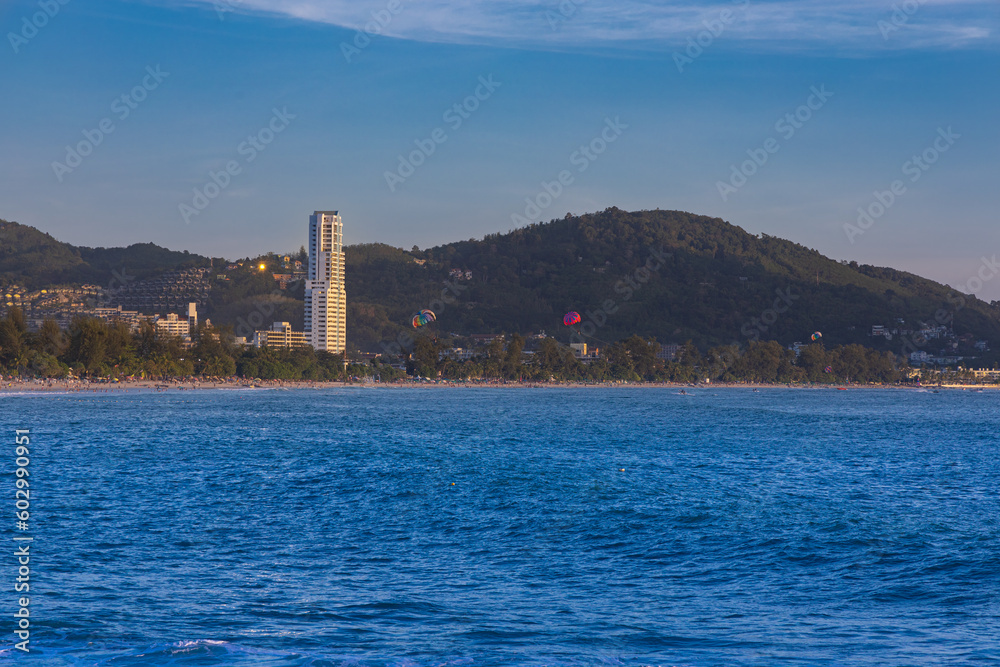 Fototapeta premium Patong Beach Phuket Thailand nice white sandy beach clear blue and turquoise waters and lovely blue skies with Palms tree sunset sunrise