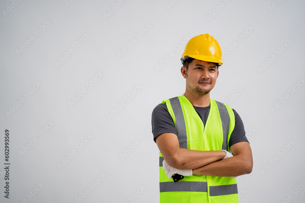 Portrait of an Asian Male Construction Worker Showing a Gesture of Work, With Isolated White Background. Portrait of an Asian Male Construction Worker Showing a Gesture of Work, With Isolated White Background.