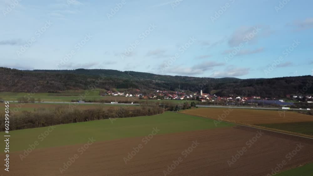 Highway along a nature reserve and idyllic village Highway along a nature reserve and idyllic village