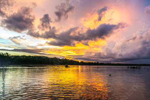 Dramatic sunset on a river in the Peruvian Amazon in Manu National Park