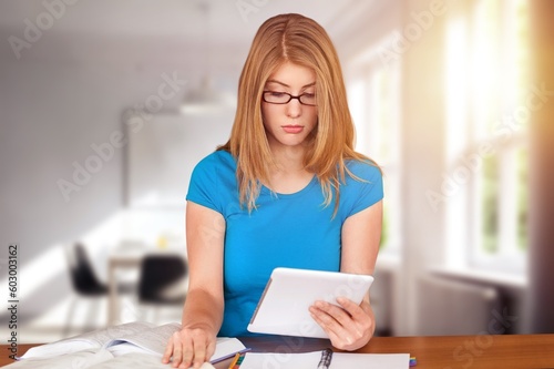 Young business woman or student working at home photo