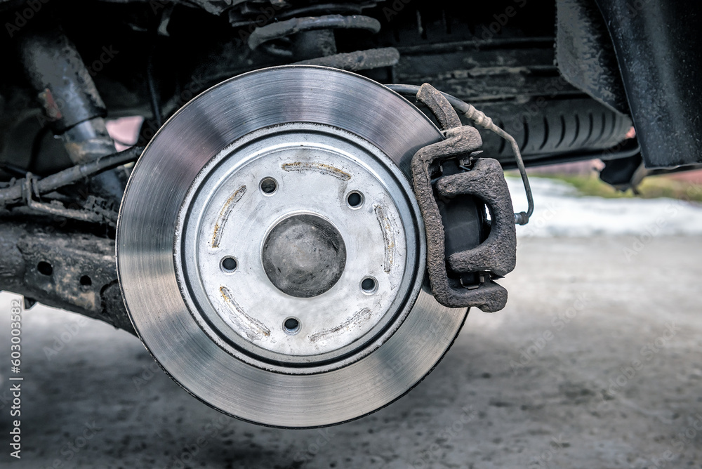 Brake pad and disk on car without wheel - obrazy, fototapety, plakaty 