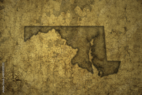 map of maryland state on a old vintage crack paper background .
