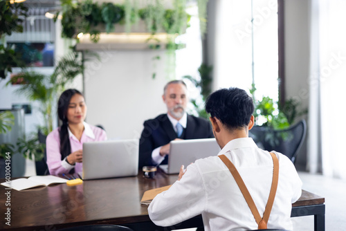 Young man employee during job interview at office workplace