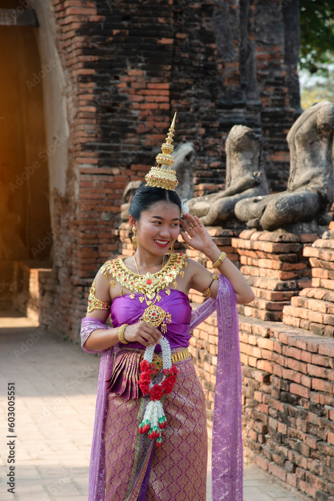 Beautiful Thai girl in traditional dress costume , Ayutthaya province, Thailand. Asian women wearing traditional Thai culture, vintage style, Thai
