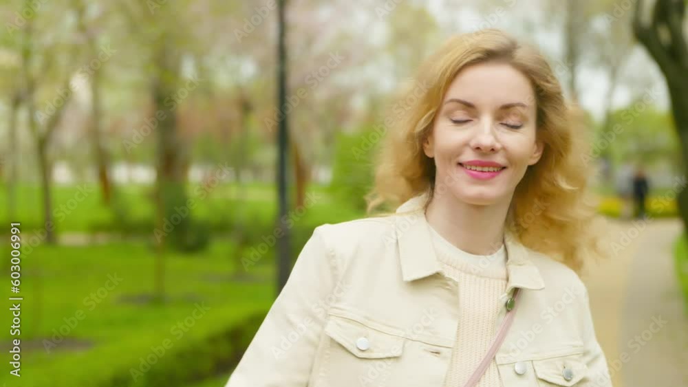 Rest, outdoor and joyful woman walking having fun smiling in park for health, peace, taking relaxing deep breath outside. Carefree stylish female lady in nature, fresh air for balance and energy. Rest, outdoor and joyful woman walking having fun smiling in park for health, peace, taking relaxing deep breath outside. Carefree stylish female lady in nature, fresh air for balance and energy.
