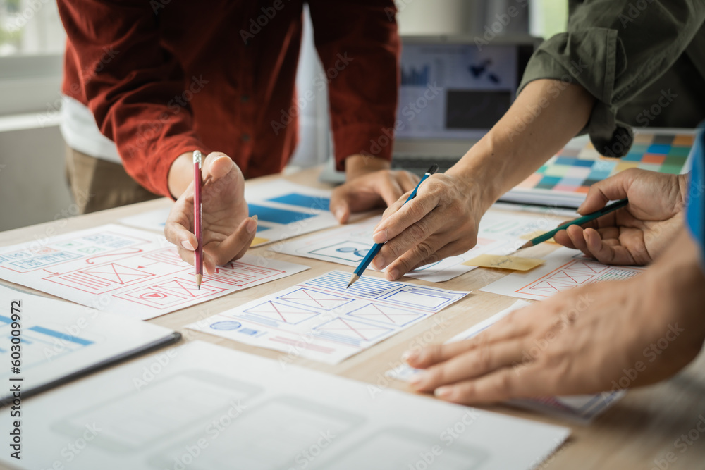 Group of asian creative team programing designers participate in all phases of the UX design. Group of asian creative team programing designers participate in all phases of the UX design.