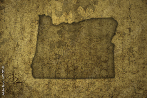 map of oregon state on a old vintage crack paper background .