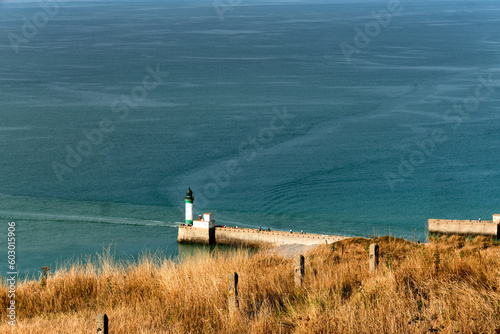 the pebble beach, lighthouse and pier from an open view at Le Treport, Seine-Maritime department in Normandy, France. photo