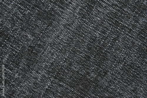 Gray color washed denim texture close up as background 