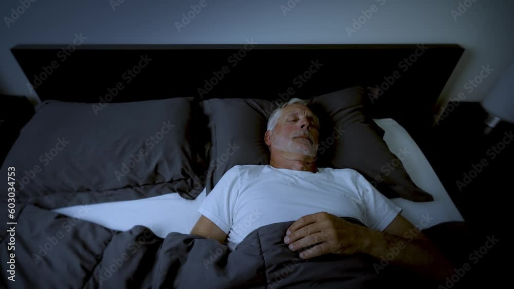 Mature adult sleeping at night