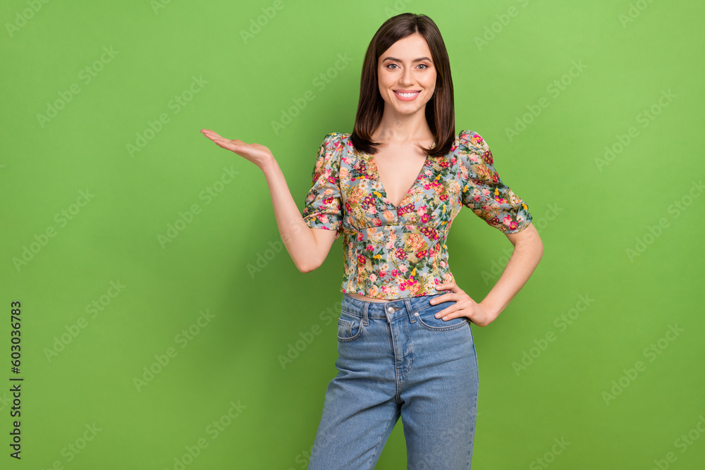 Portrait of amazing beauty lady hold open palm demonstrating sale product wear vintage blouse isolated green color background Portrait of amazing beauty lady hold open palm demonstrating sale product wear vintage blouse isolated green color background