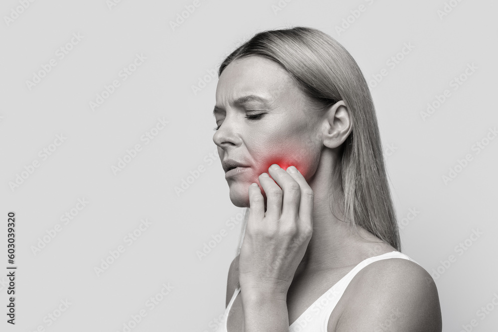 Unhappy woman suffering from strong tooth pain, copy space - obrazy, fototapety, plakaty 
