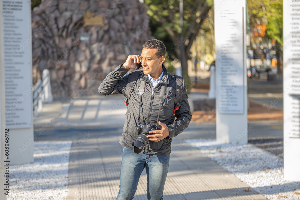 Young latin man talking on mobile phone with copy space.