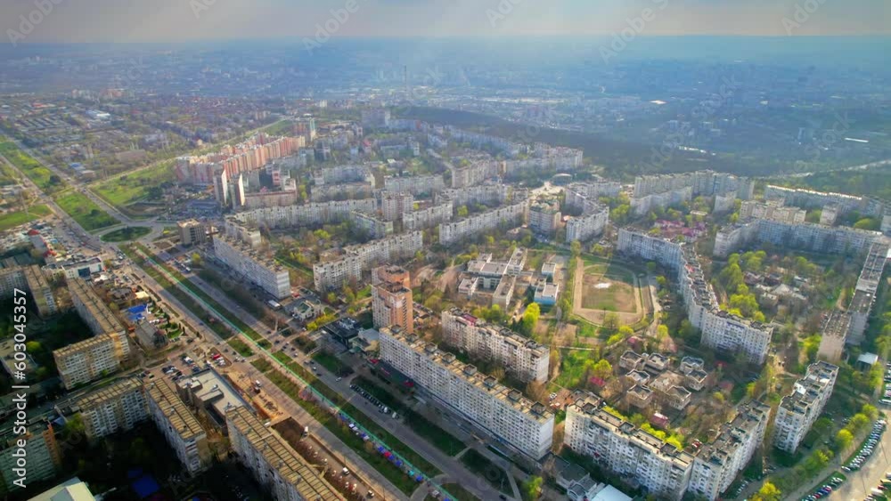 Aerial drone view of Chisinau in spring, Moldova. Residential district with multiple flats, greenery, roads with moving cars Aerial drone view of Chisinau in spring, Moldova. Residential district with multiple flats, greenery, roads with moving cars