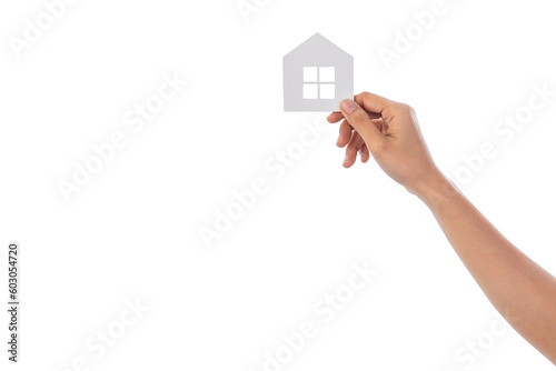 Hand holding a wooden house isolated on white background with clipping path.