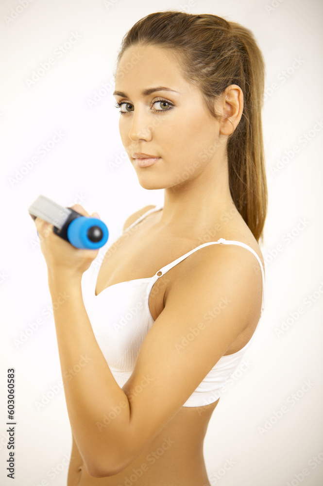 Young beautiful woman during fitness time and exercising
