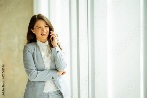 Young woman with mobile pho...