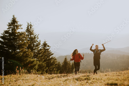 Smiling couple walking with...