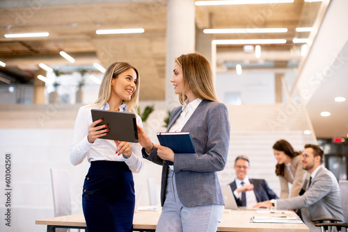 Two young business women lo...