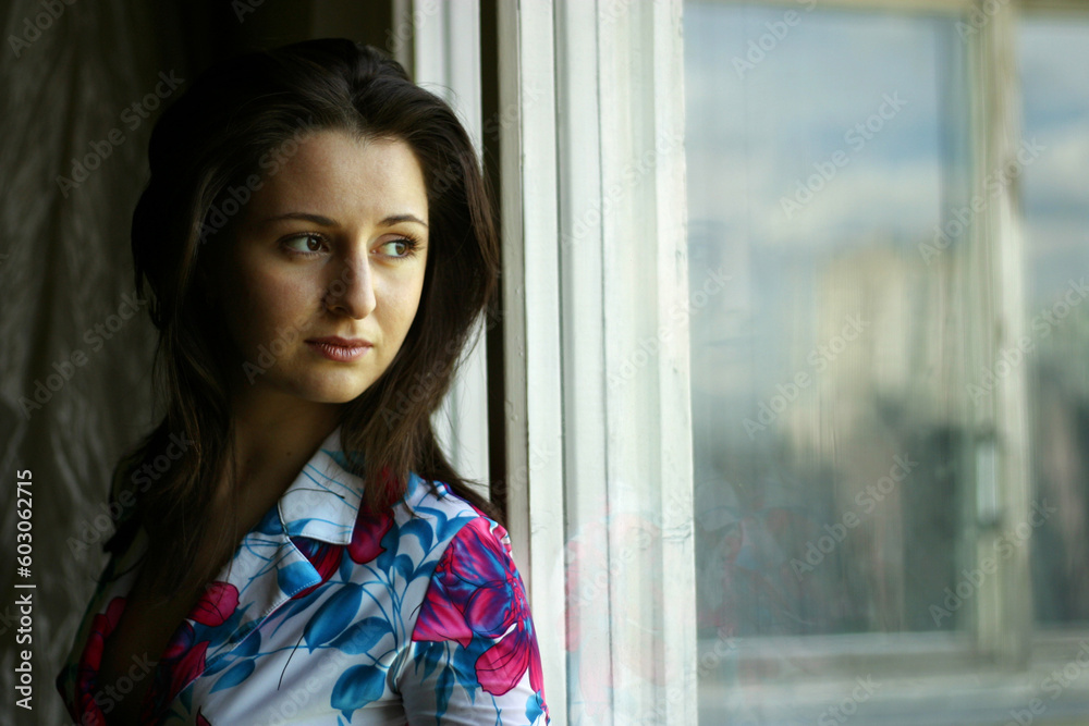 The girl looking out of the window The girl looking out of the window