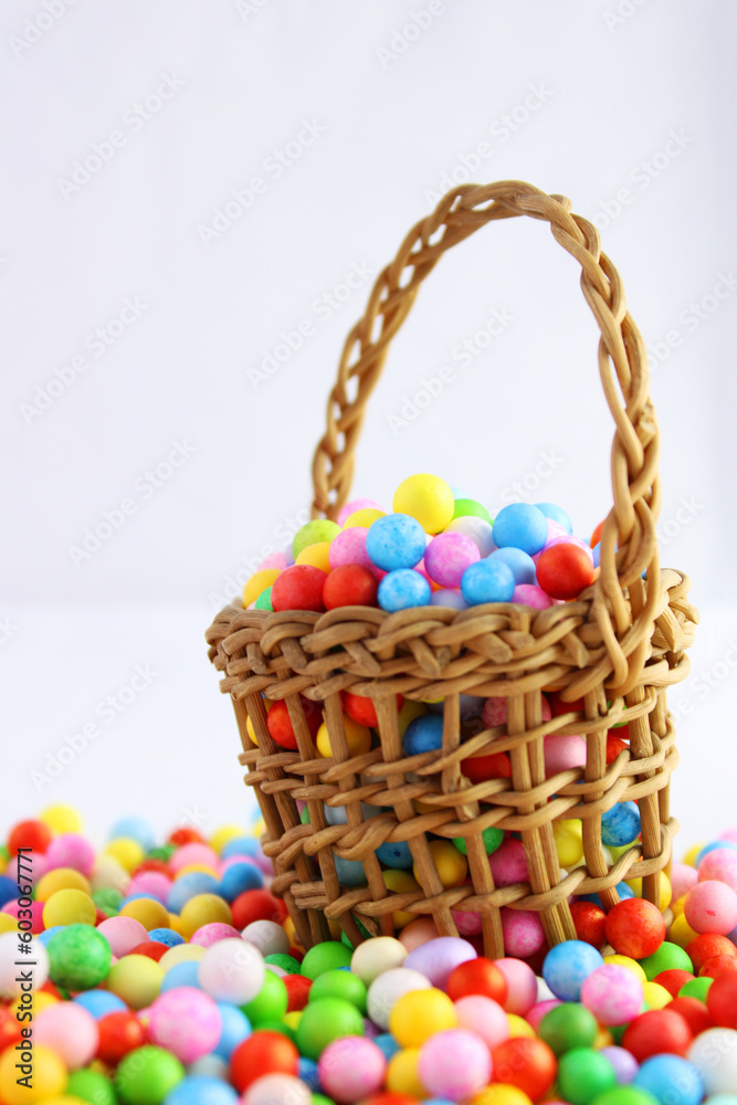 Fototapeta premium Handmade basket with colorful polyfoam spheres