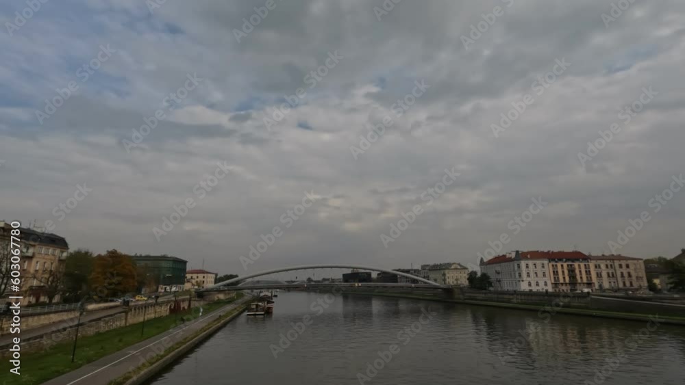 The Vistula River that flows through the heart of the city of Krakow. Against a cloudy summer sky. poland The Vistula River that flows through the heart of the city of Krakow. Against a cloudy summer sky. poland
