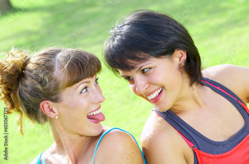 Portrait of two young woman having fun in summer environment