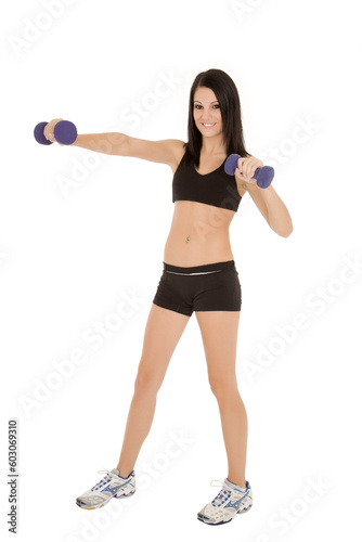 Beautiful Caucasian woman working out with dumbbells on white background