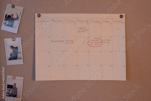 Schedule hanging on pin board in office