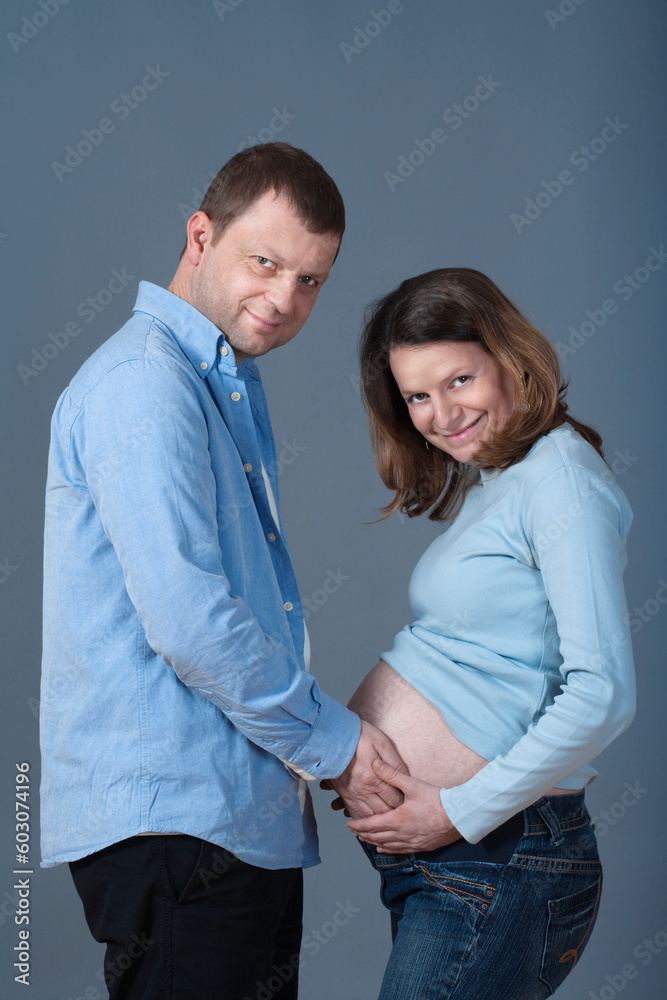 expecting couple - man touching his pregnant wife«s belly expecting couple - man touching his pregnant wife«s belly