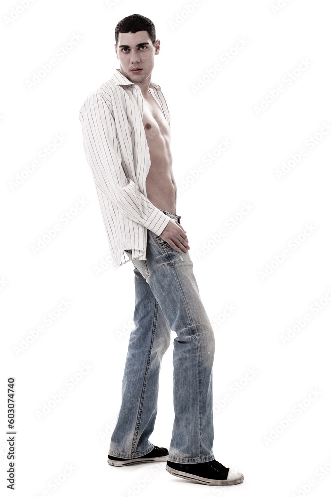A muscular model in a white open shirt and jean over white background A muscular model in a white open shirt and jean over white background
