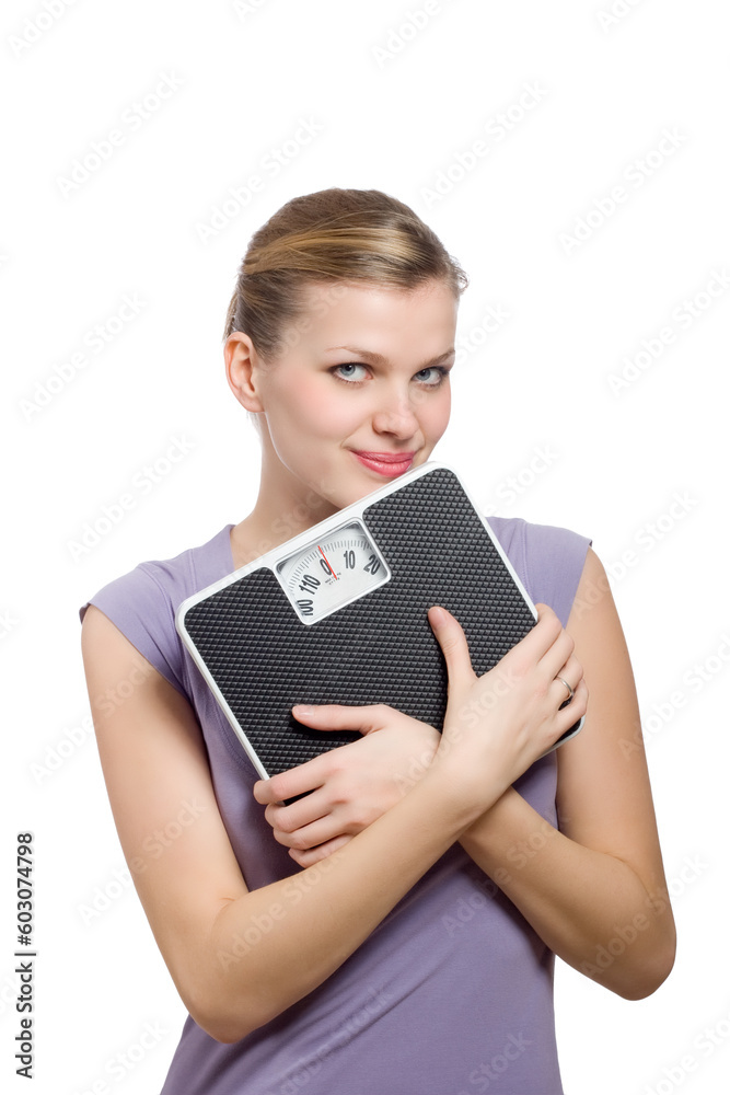 smiling young woman holding a weight scale over white background smiling young woman holding a weight scale over white background