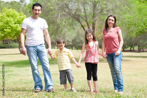 Family posing to camera in the park,outdoor