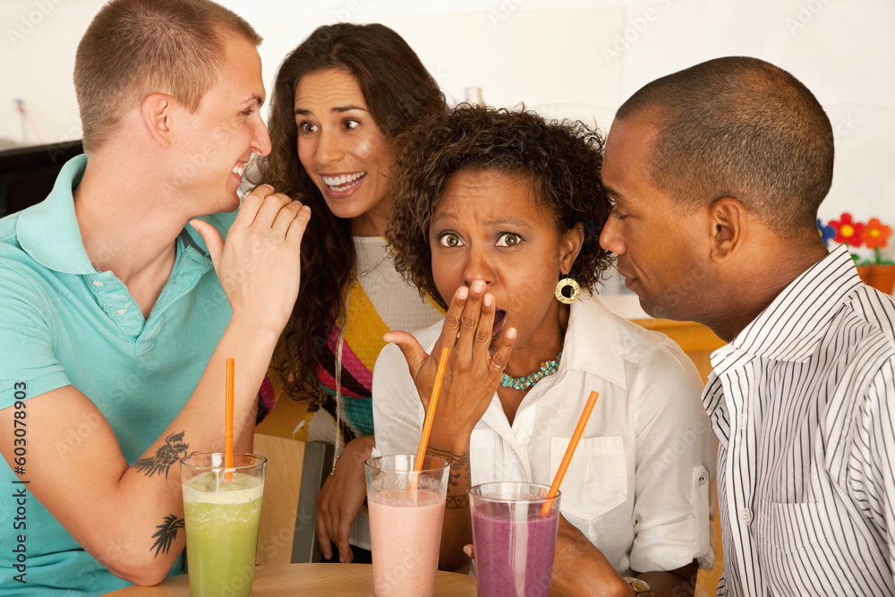 Two couples at a cafe drinking frozen beverages. Horizontal shot. Two couples at a cafe drinking frozen beverages. Horizontal shot.