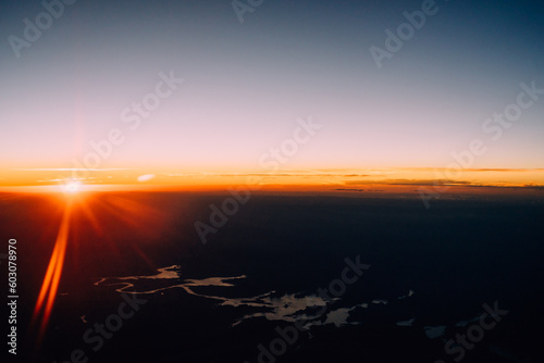  horizon at sunset out of a plane window