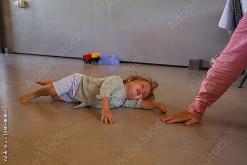 cranky child with a parent 
 photo