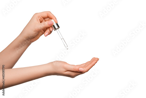 Hands of a beautiful woman dripping serum collagen. Female hands isolate.