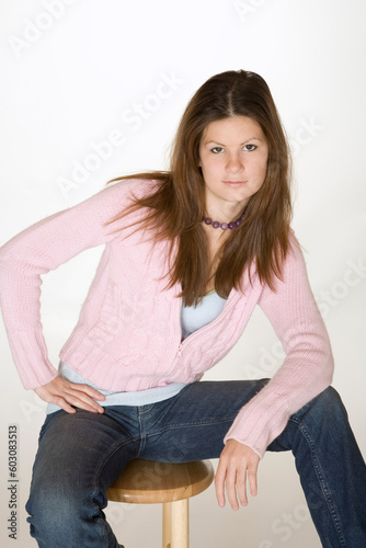 Teenage girl posing on white background