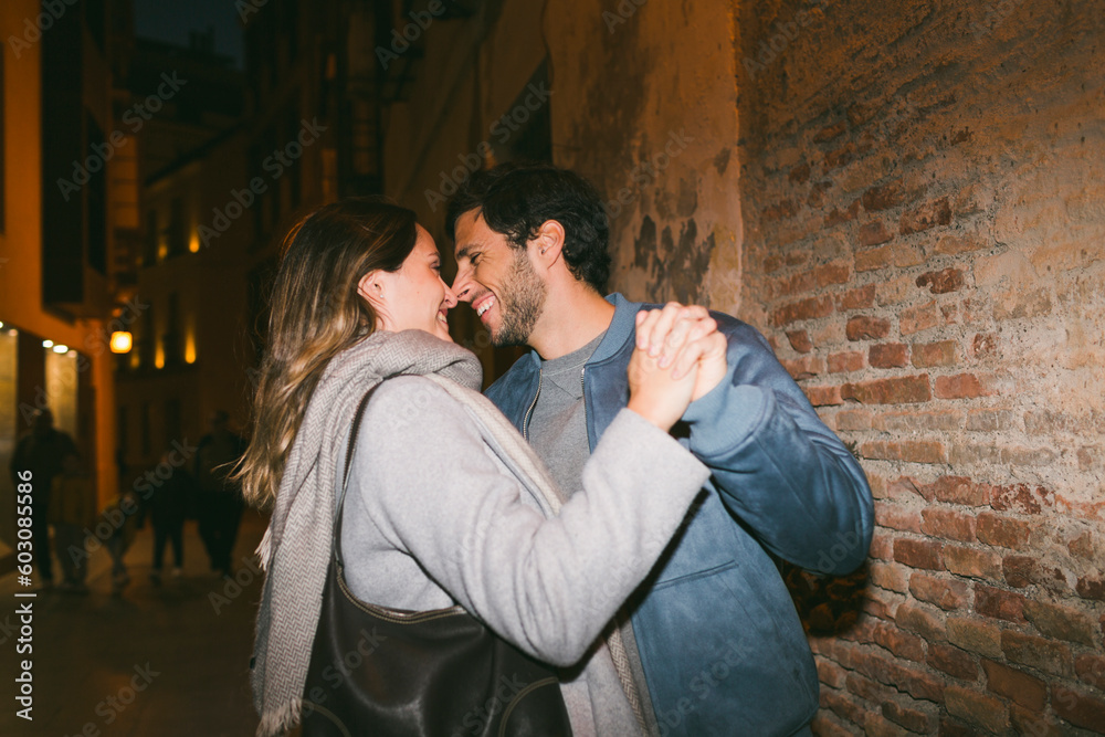 Smiling couple dancing in the street Smiling couple dancing in the street
