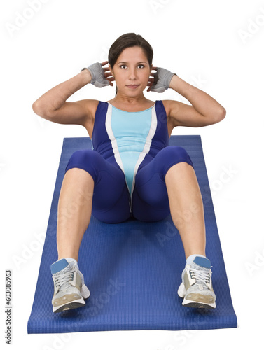 Image of a woman doing aerobics on a blue mat.Shot with Canon 70-200mm f/2.8L IS USM
